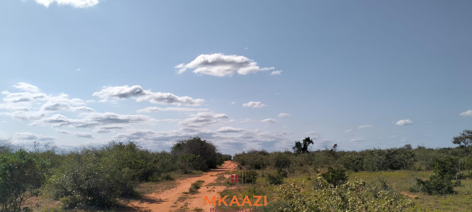 Prime 6-acre road frontage land for sale in Baolala with direct tarmac frontage, water and electricity on site, freehold title, ideal for commercial, residential, or agricultural investment.