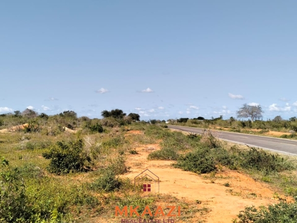 Prime 6-acre road frontage land for sale in Baolala with direct tarmac frontage, water and electricity on site, freehold title, ideal for commercial, residential, or agricultural investment.