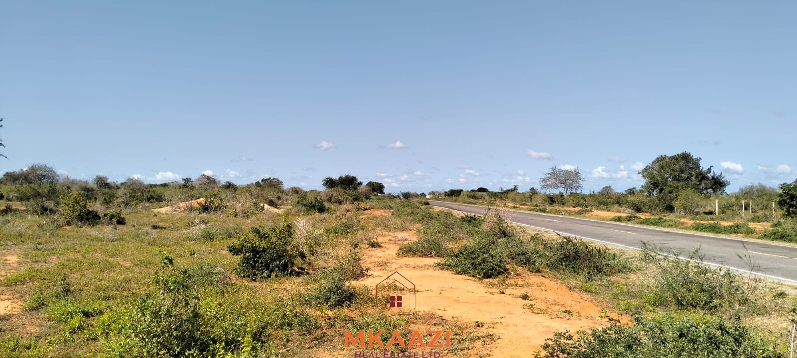 Prime 6-acre road frontage land for sale in Baolala with direct tarmac frontage, water and electricity on site, freehold title, ideal for commercial, residential, or agricultural investment.