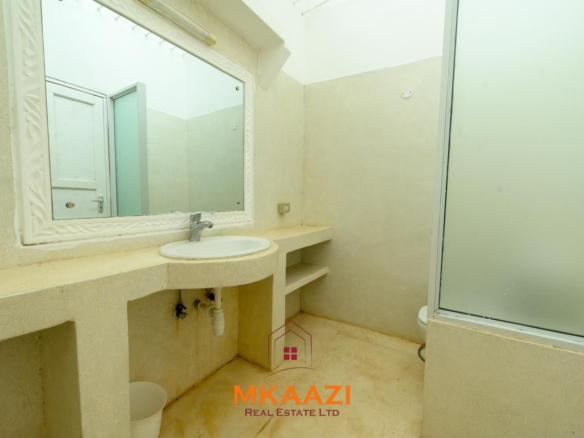 Fully furnished 4-bedroom riverside holiday house accommodating up to 10 guests with hippo views, spacious compound, and fully equipped kitchen.