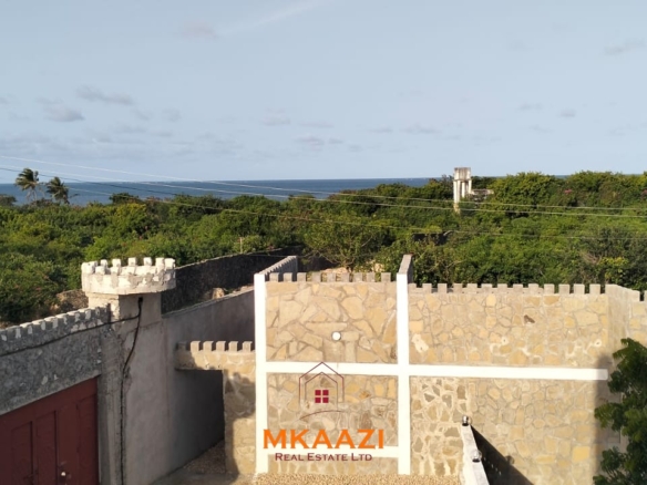 Newly built 3-bedroom house with SQ for rent on Casuarina Road, Malindi, featuring a private compound, ocean views, garden, gazebo, and covered patio.
