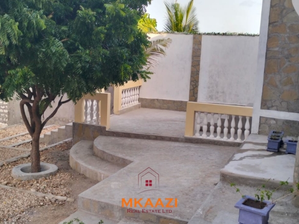 Newly built 3-bedroom house with SQ for rent on Casuarina Road, Malindi, featuring a private compound, ocean views, garden, gazebo, and covered patio.
