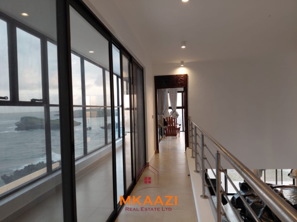 Luxury fully furnished 4-bedroom beachfront villa for sale in Love Island, Watamu with private pool, borehole, tropical gardens, and direct access to white sandy beaches.