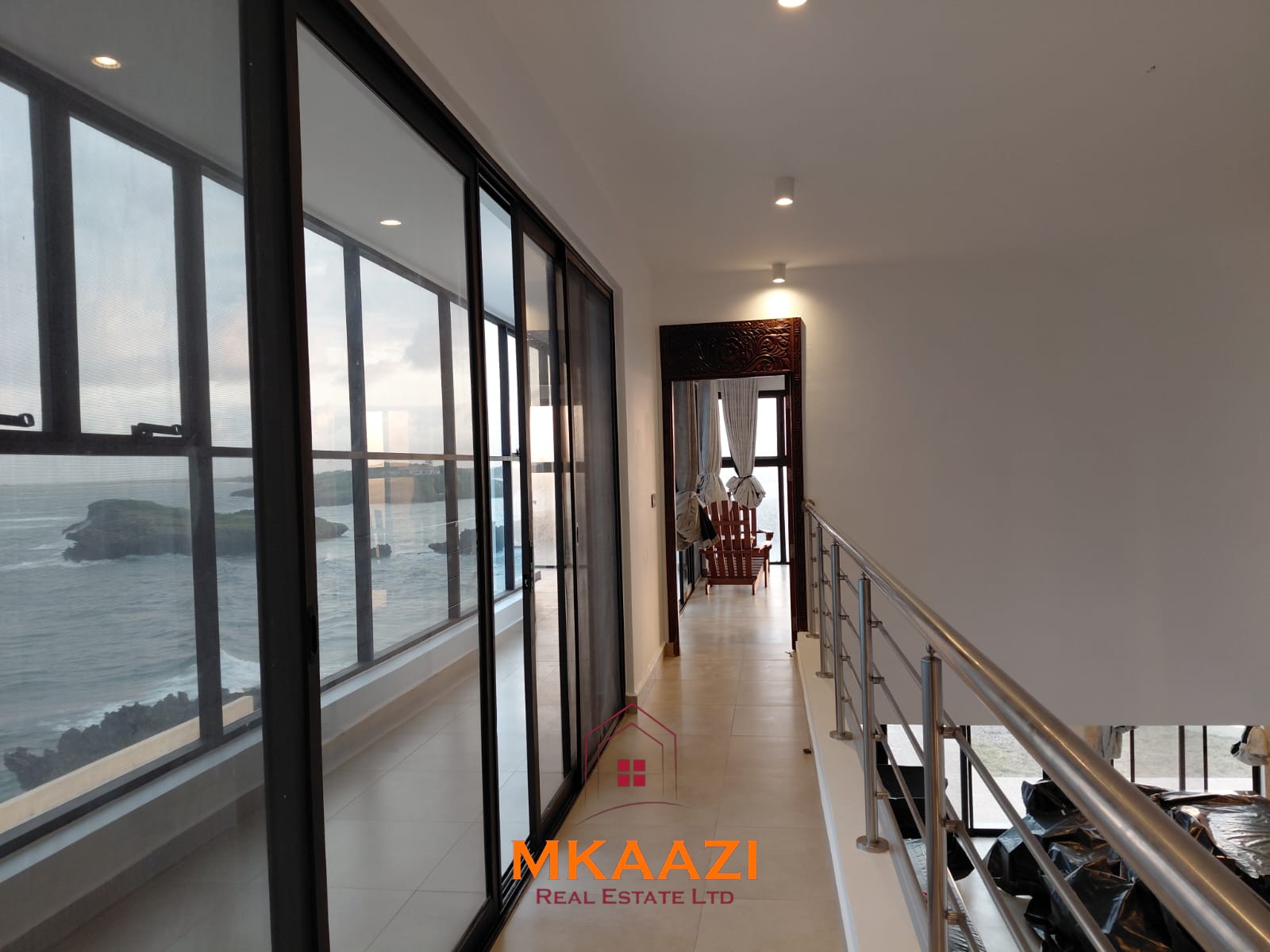 Luxury fully furnished 4-bedroom beachfront villa for sale in Love Island, Watamu with private pool, borehole, tropical gardens, and direct access to white sandy beaches.