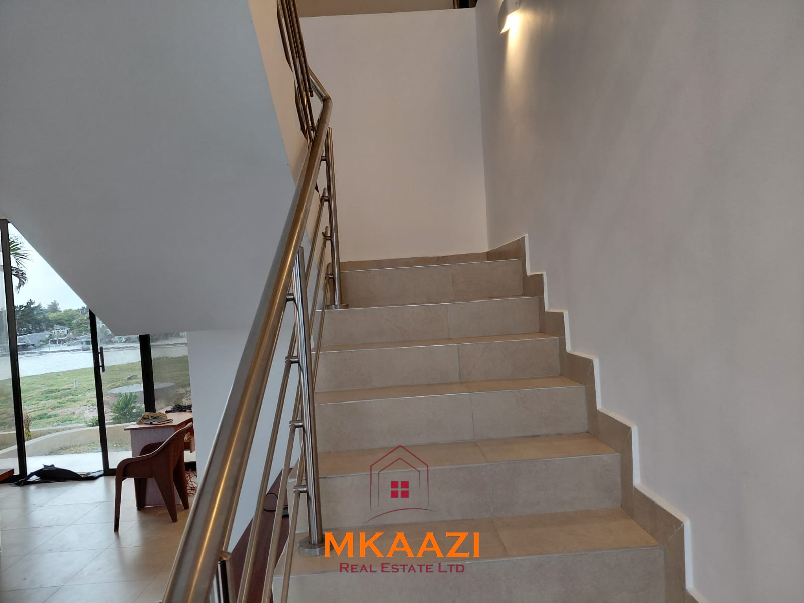 Luxury fully furnished 4-bedroom beachfront villa for sale in Love Island, Watamu with private pool, borehole, tropical gardens, and direct access to white sandy beaches.