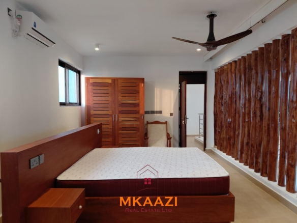 Luxury fully furnished 4-bedroom beachfront villa for sale in Love Island, Watamu with private pool, borehole, tropical gardens, and direct access to white sandy beaches.