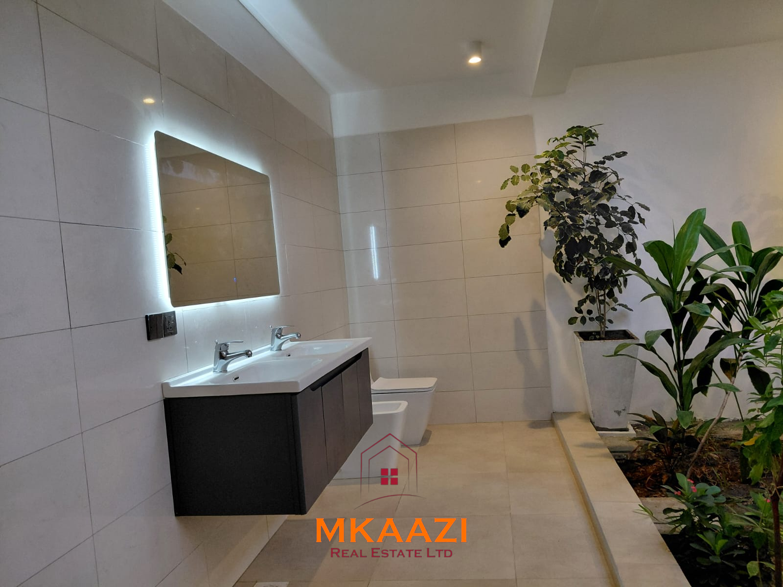 Luxury fully furnished 4-bedroom beachfront villa for sale in Love Island, Watamu with private pool, borehole, tropical gardens, and direct access to white sandy beaches.
