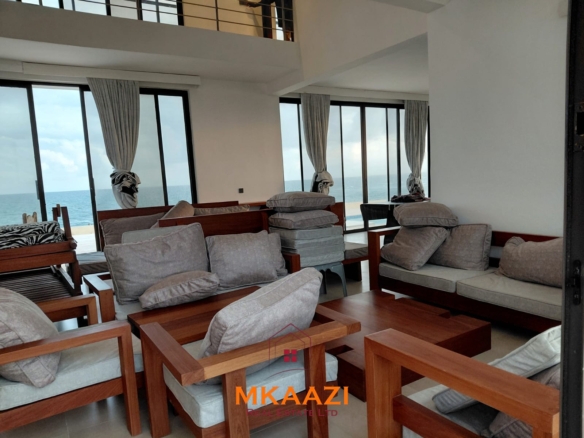 Luxury fully furnished 4-bedroom beachfront villa for sale in Love Island, Watamu with private pool, borehole, tropical gardens, and direct access to white sandy beaches.