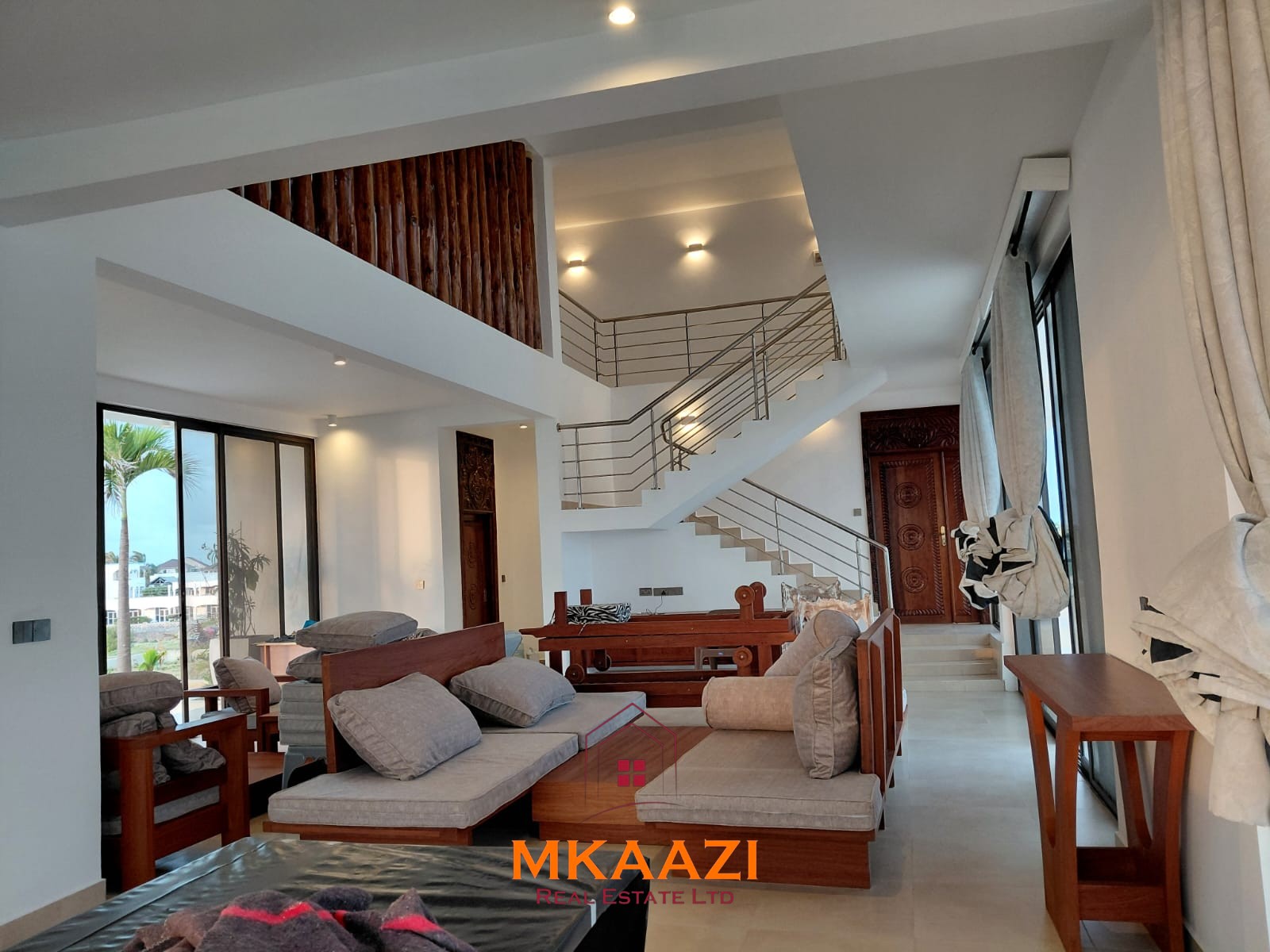 Luxury fully furnished 4-bedroom beachfront villa for sale in Love Island, Watamu with private pool, borehole, tropical gardens, and direct access to white sandy beaches.