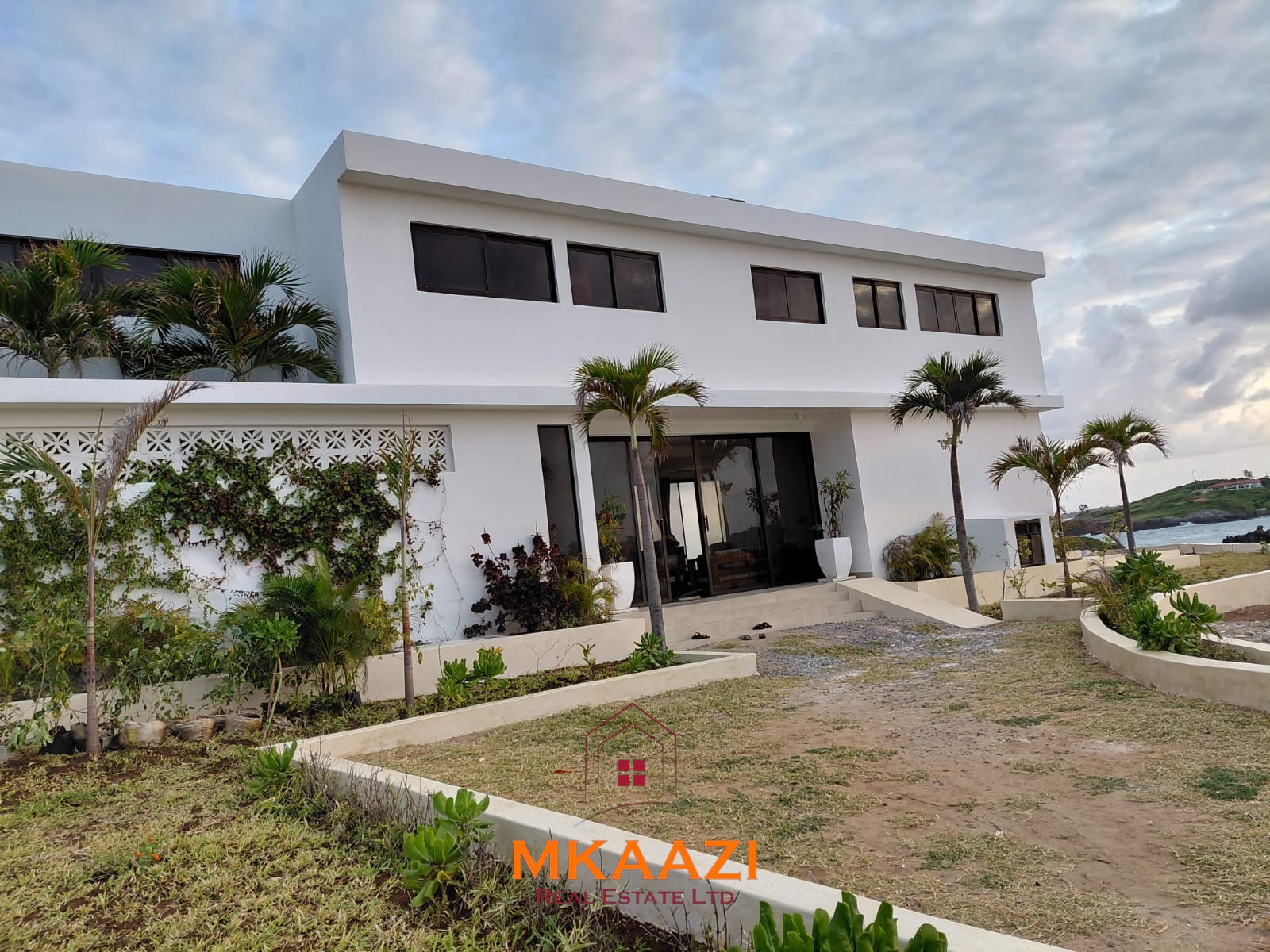Luxury fully furnished 4-bedroom beachfront villa for sale in Love Island, Watamu with private pool, borehole, tropical gardens, and direct access to white sandy beaches.