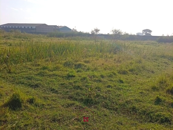 5-acre industrial-zoned land for sale in Thika Municipality with ready title deed, flat terrain, and easy access to major roads and utilities.