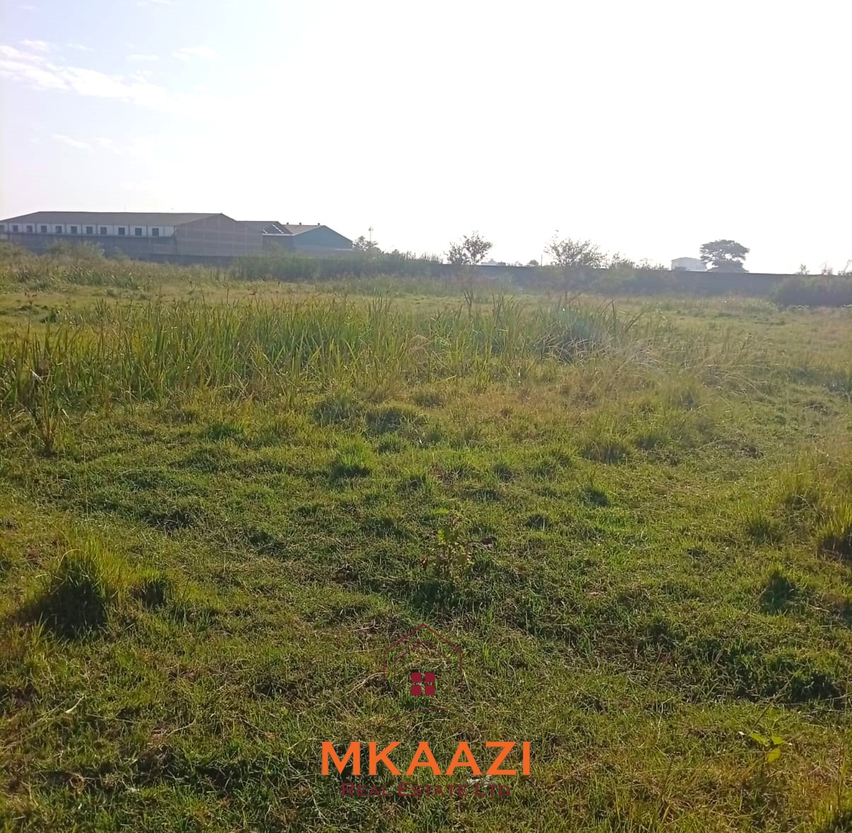 5-acre industrial-zoned land for sale in Thika Municipality with ready title deed, flat terrain, and easy access to major roads and utilities.