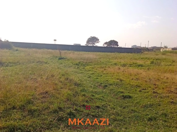 5-acre industrial-zoned land for sale in Thika Municipality with ready title deed, flat terrain, and easy access to major roads and utilities.