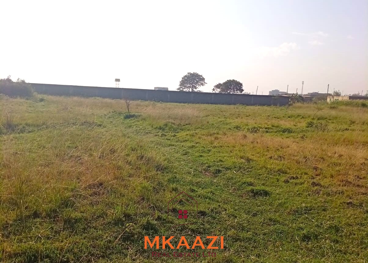 5-acre industrial-zoned land for sale in Thika Municipality with ready title deed, flat terrain, and easy access to major roads and utilities.