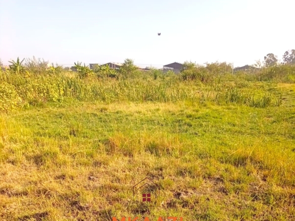 5-acre industrial-zoned land for sale in Thika Municipality with ready title deed, flat terrain, and easy access to major roads and utilities.