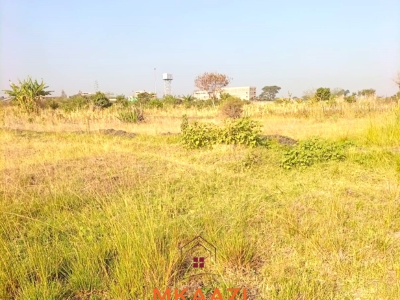 5-acre industrial-zoned land for sale in Thika Municipality with ready title deed, flat terrain, and easy access to major roads and utilities.