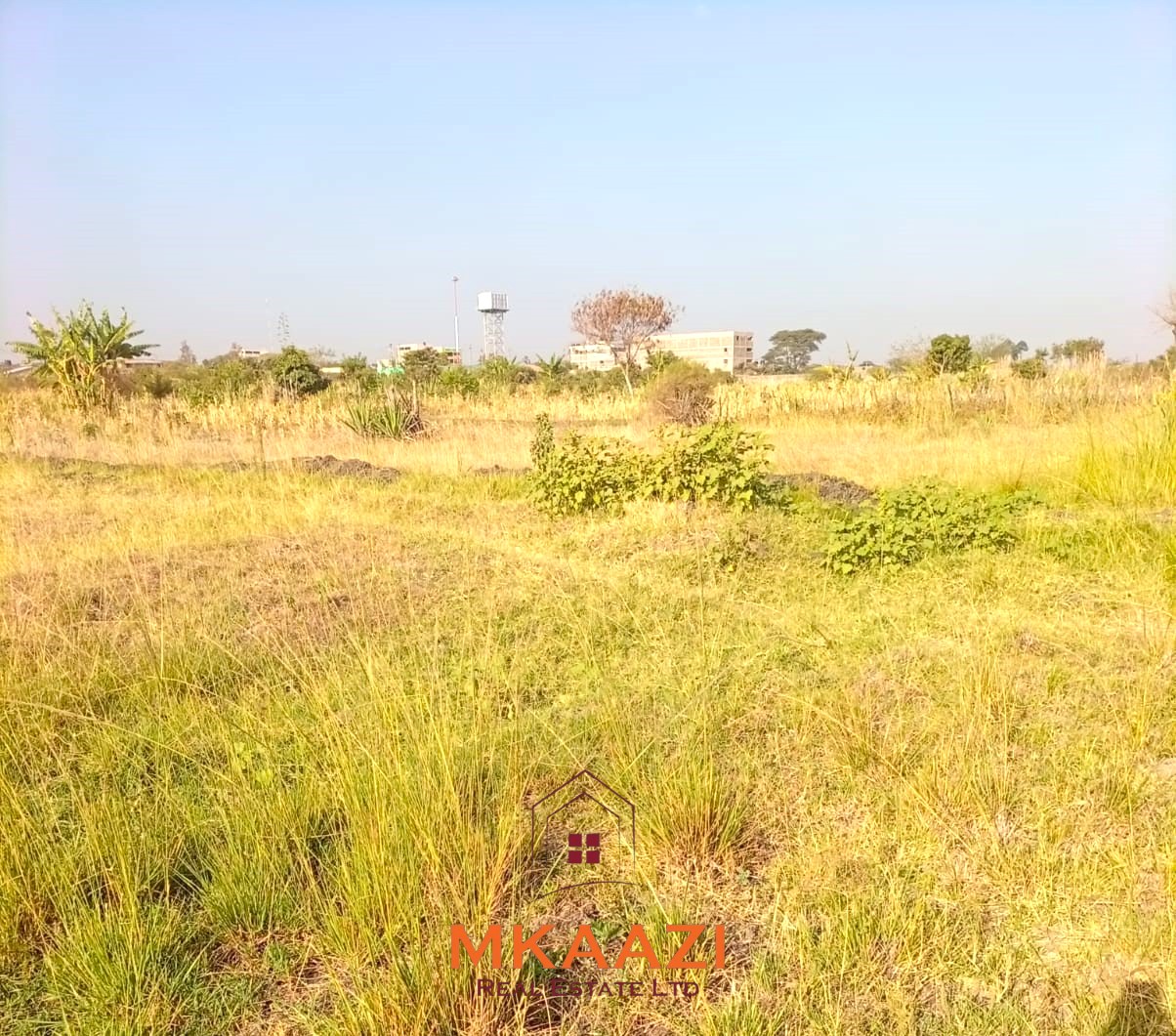 5-acre industrial-zoned land for sale in Thika Municipality with ready title deed, flat terrain, and easy access to major roads and utilities.