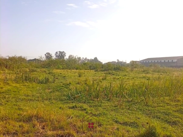 5-acre industrial-zoned land for sale in Thika Municipality with ready title deed, flat terrain, and easy access to major roads and utilities.