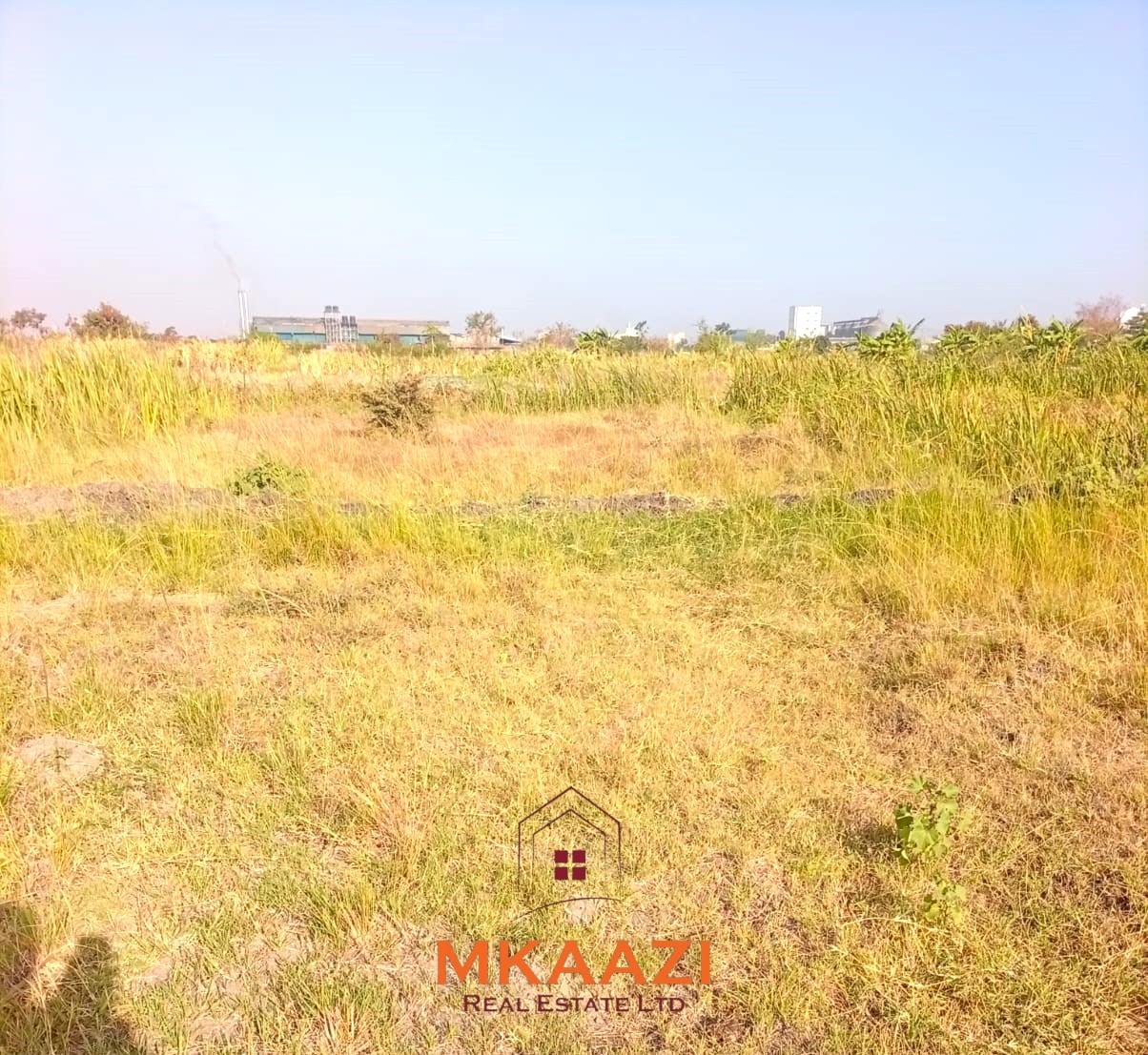 5-acre industrial-zoned land for sale in Thika Municipality with ready title deed, flat terrain, and easy access to major roads and utilities.
