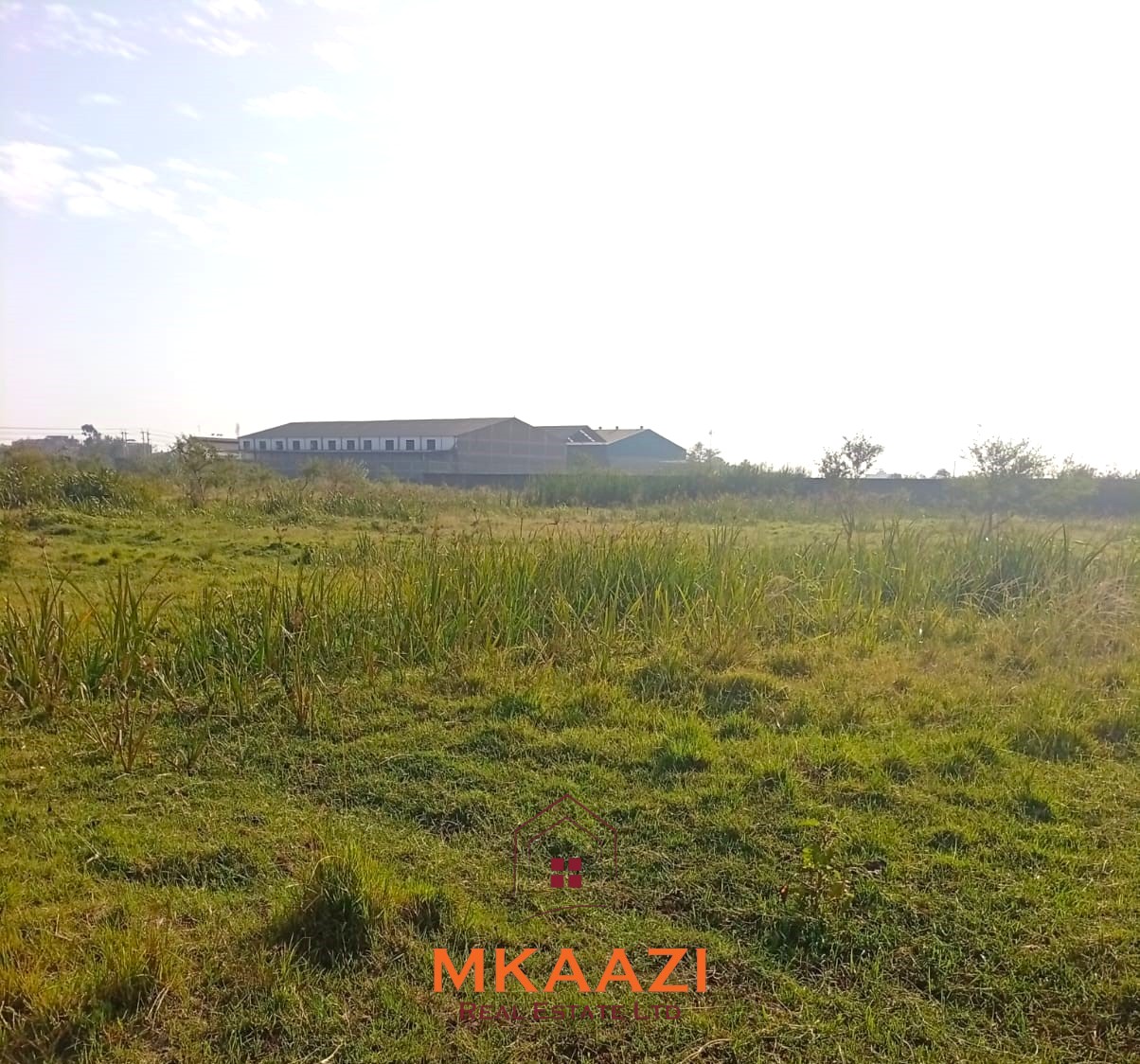 5-acre industrial-zoned land for sale in Thika Municipality with ready title deed, flat terrain, and easy access to major roads and utilities.
