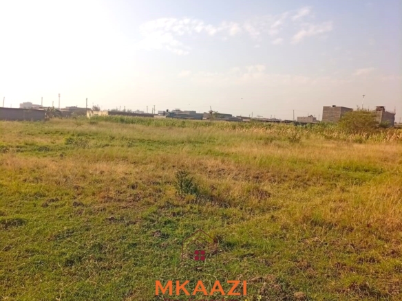 5-acre industrial-zoned land for sale in Thika Municipality with ready title deed, flat terrain, and easy access to major roads and utilities.