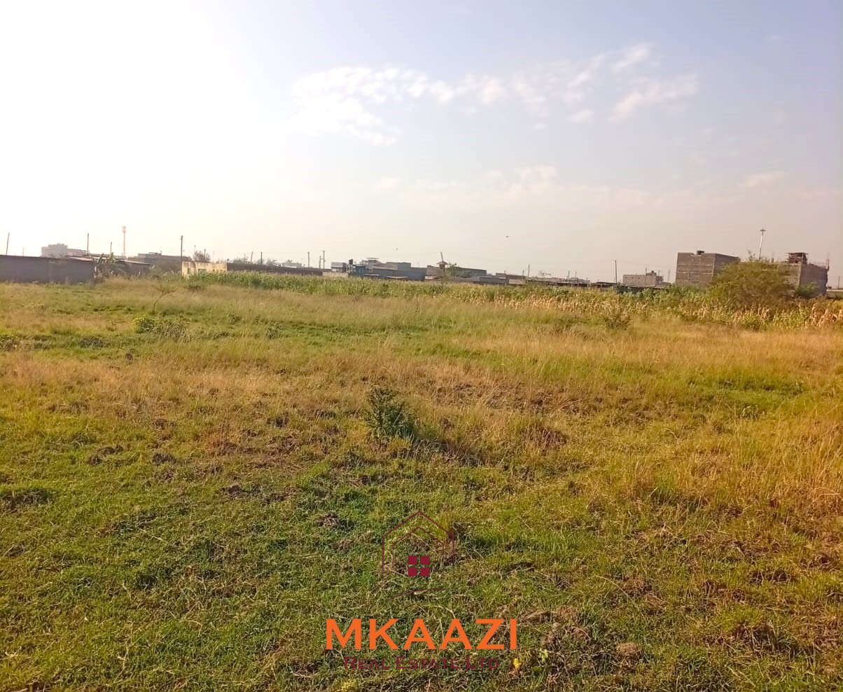 5-acre industrial-zoned land for sale in Thika Municipality with ready title deed, flat terrain, and easy access to major roads and utilities.