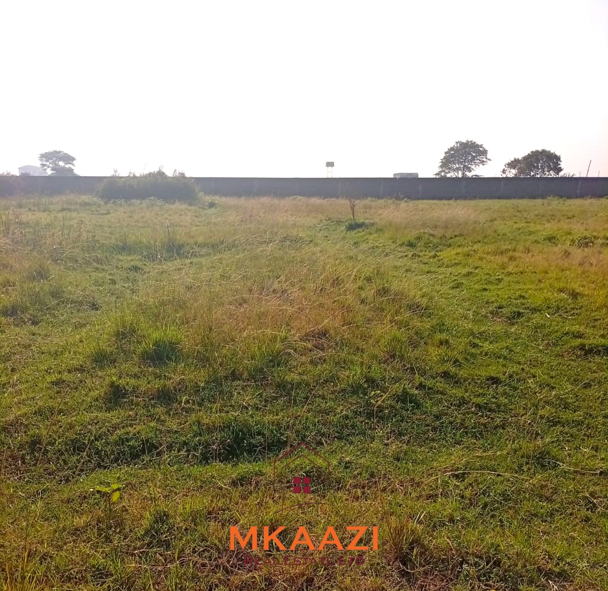 5-acre industrial-zoned land for sale in Thika Municipality with ready title deed, flat terrain, and easy access to major roads and utilities.