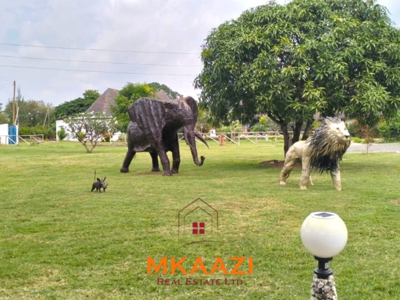 Elegant 4-bedroom all en-suite luxury villa with private swimming pool, landscaped one-acre garden, guest rooms, and entertainment area on Lamu Road, Malindi.
