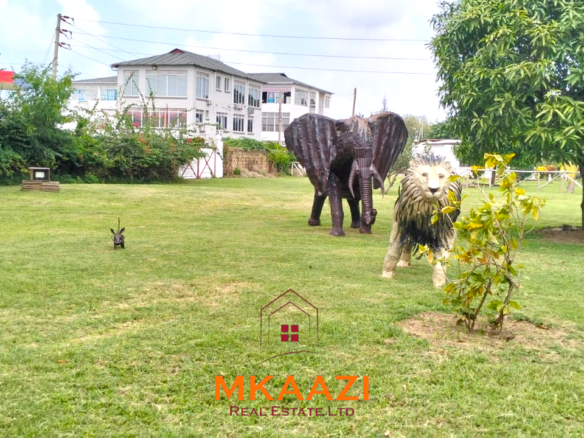 Elegant 4-bedroom all en-suite luxury villa with private swimming pool, landscaped one-acre garden, guest rooms, and entertainment area on Lamu Road, Malindi.