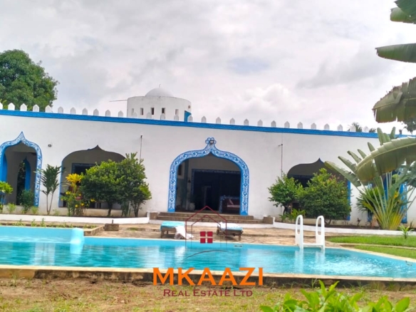 Elegant 4-bedroom all en-suite luxury villa with private swimming pool, landscaped one-acre garden, guest rooms, and entertainment area on Lamu Road, Malindi.