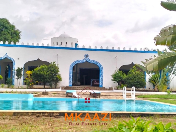 Elegant 4-bedroom all en-suite luxury villa with private swimming pool, landscaped one-acre garden, guest rooms, and entertainment area on Lamu Road, Malindi.