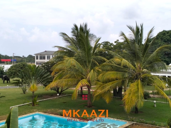 Elegant 4-bedroom all en-suite luxury villa with private swimming pool, landscaped one-acre garden, guest rooms, and entertainment area on Lamu Road, Malindi.