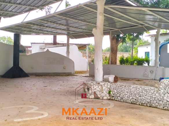 Elegant 4-bedroom all en-suite luxury villa with private swimming pool, landscaped one-acre garden, guest rooms, and entertainment area on Lamu Road, Malindi.