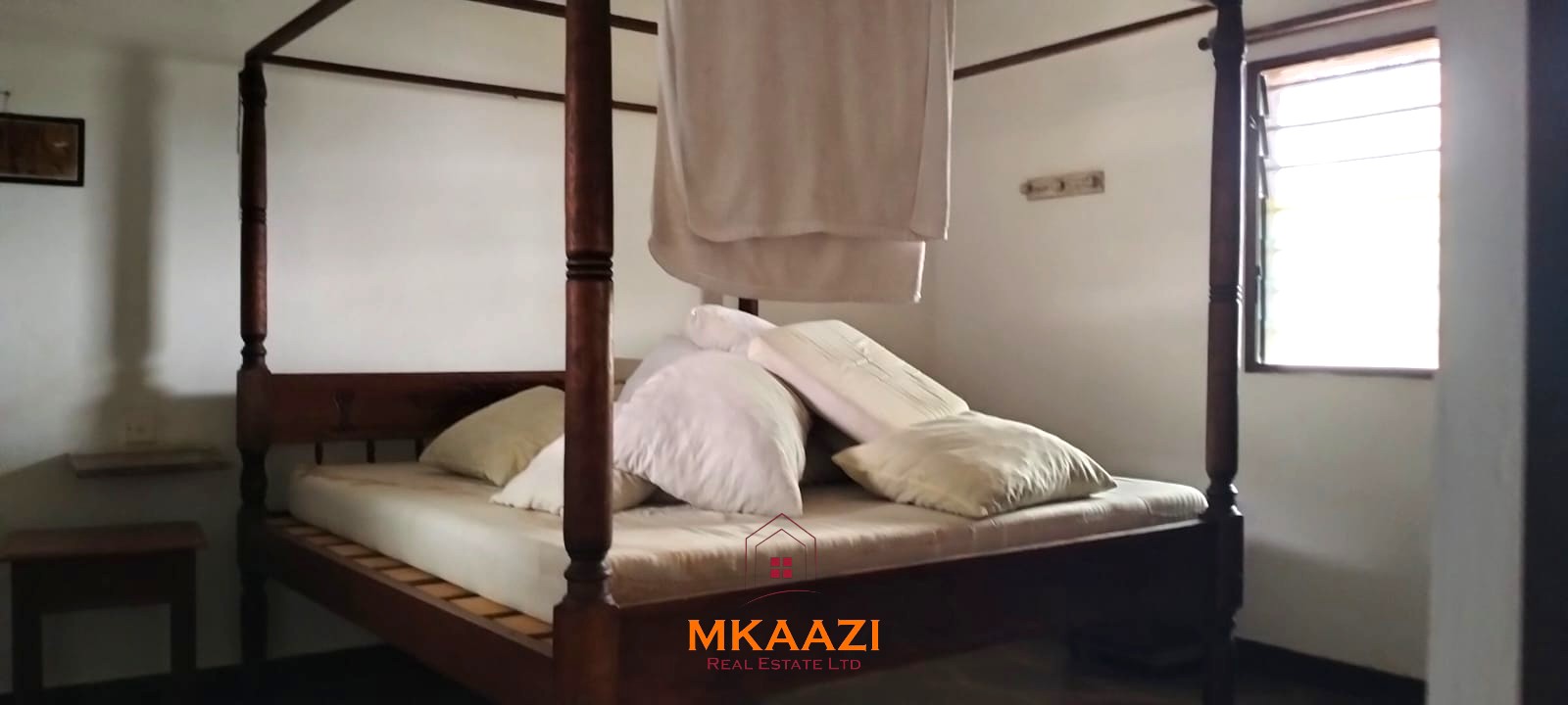 2-bedroom all en-suite Swahili villa with makuti roof, shared swimming pool, and landscaped gardens for sale on Lamu Road, Malindi.