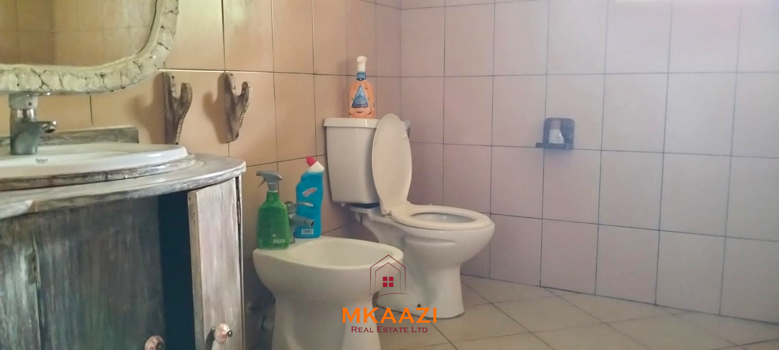 2-bedroom all en-suite Swahili villa with makuti roof, shared swimming pool, and landscaped gardens for sale on Lamu Road, Malindi.