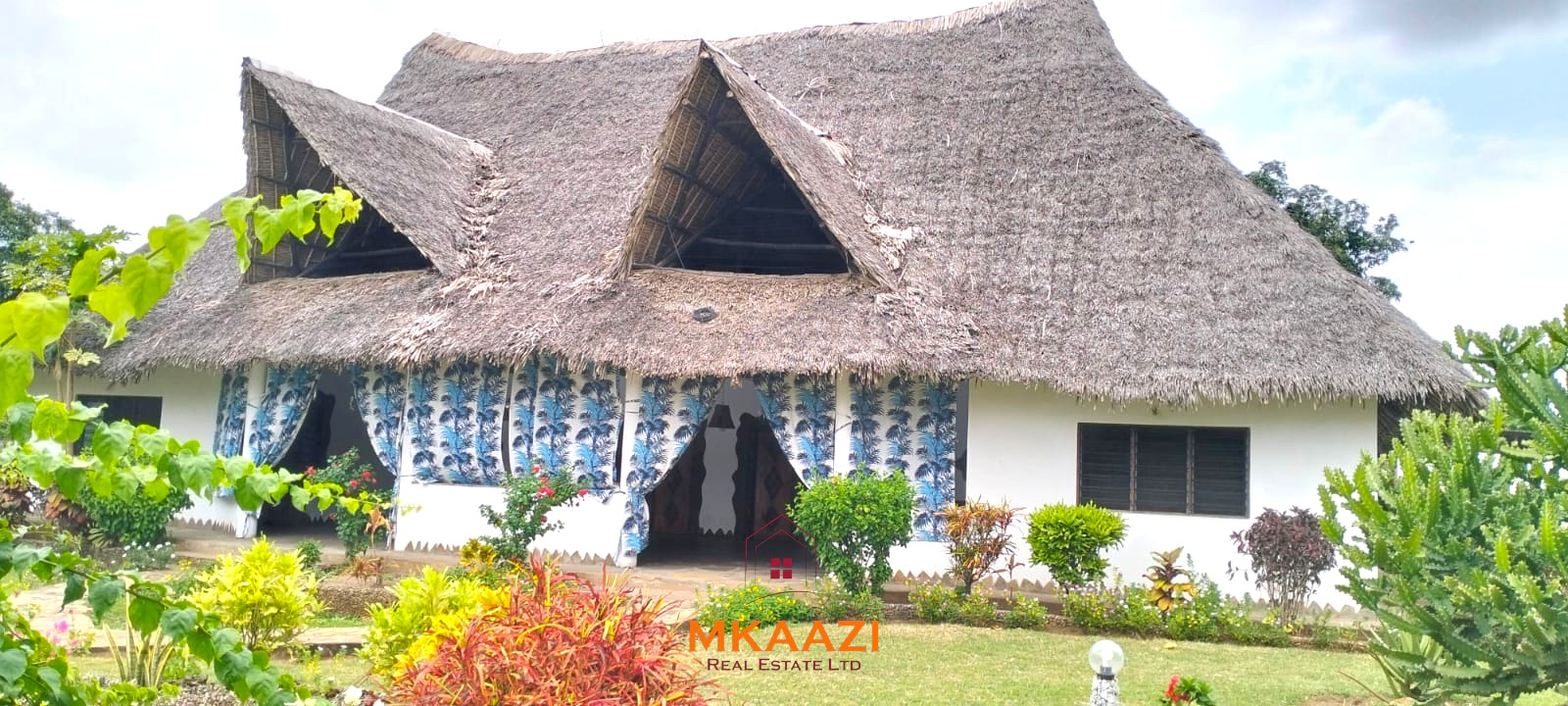 2-bedroom all en-suite Swahili villa with makuti roof, shared swimming pool, and landscaped gardens for sale on Lamu Road, Malindi.