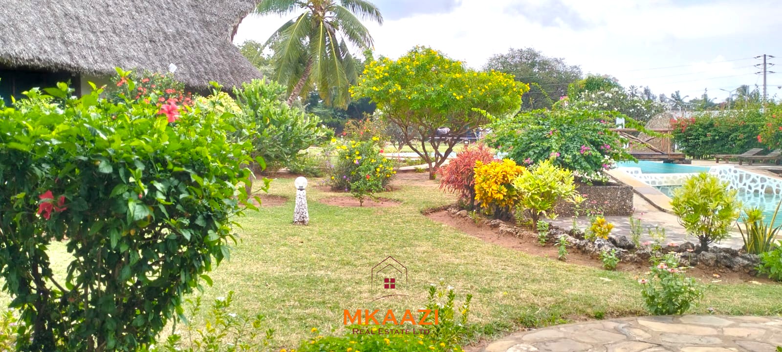 2-bedroom all en-suite Swahili villa with makuti roof, shared swimming pool, and landscaped gardens for sale on Lamu Road, Malindi.