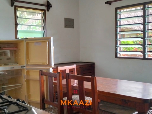 2-bedroom all en-suite Swahili villa with makuti roof, shared swimming pool, and landscaped gardens for sale on Lamu Road, Malindi.