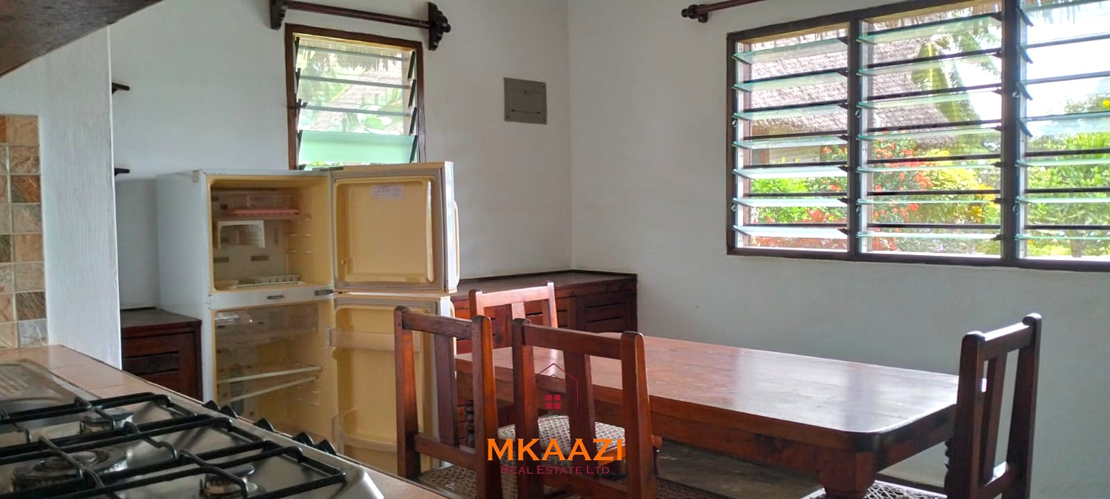 2-bedroom all en-suite Swahili villa with makuti roof, shared swimming pool, and landscaped gardens for sale on Lamu Road, Malindi.