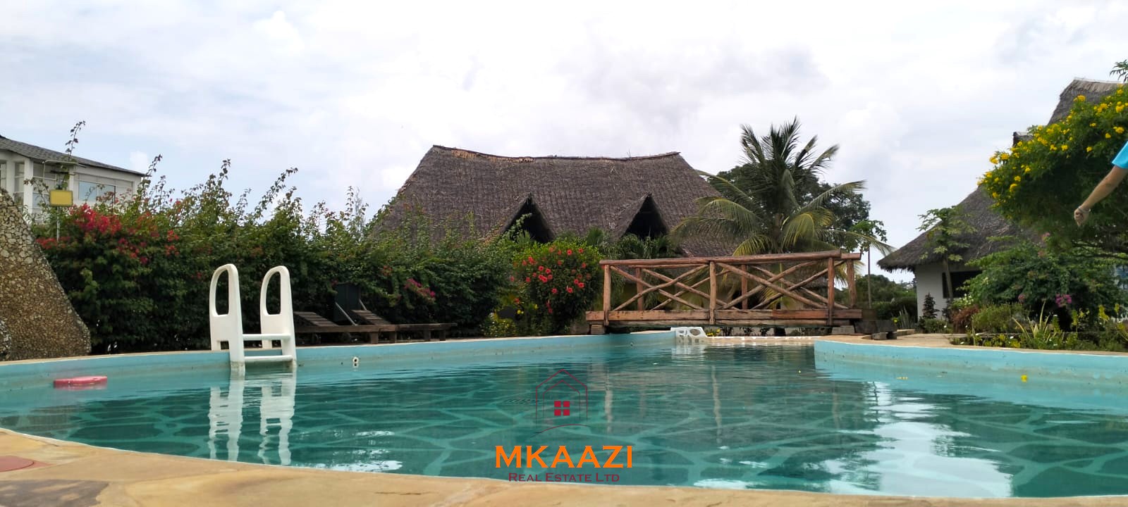 2-bedroom all en-suite Swahili villa with makuti roof, shared swimming pool, and landscaped gardens for sale on Lamu Road, Malindi.