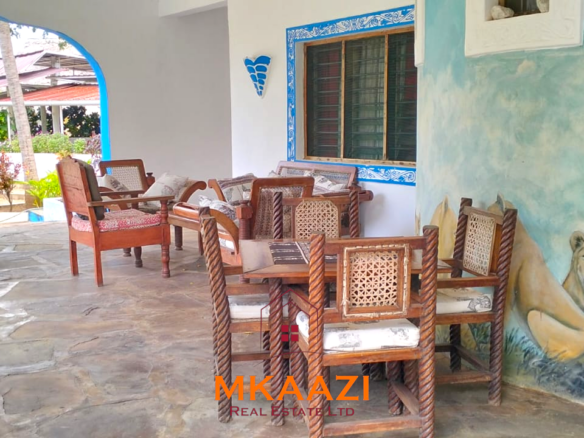 Elegant 4-bedroom all en-suite luxury villa with private swimming pool, landscaped one-acre garden, guest rooms, and entertainment area on Lamu Road, Malindi.
