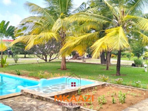 Elegant 4-bedroom all en-suite luxury villa with private swimming pool, landscaped one-acre garden, guest rooms, and entertainment area on Lamu Road, Malindi.