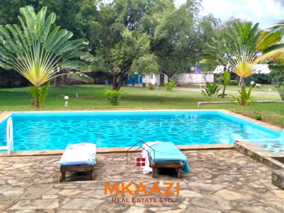 Elegant 4-bedroom all en-suite luxury villa with private swimming pool, landscaped one-acre garden, guest rooms, and entertainment area on Lamu Road, Malindi.
