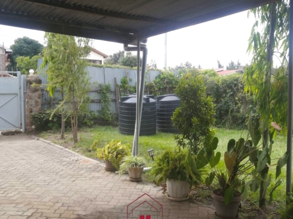 Spacious 3-bedroom bungalow for sale in Old Donholm on a 100×120 ft plot with large compound, cabro driveway, and two water tanks.