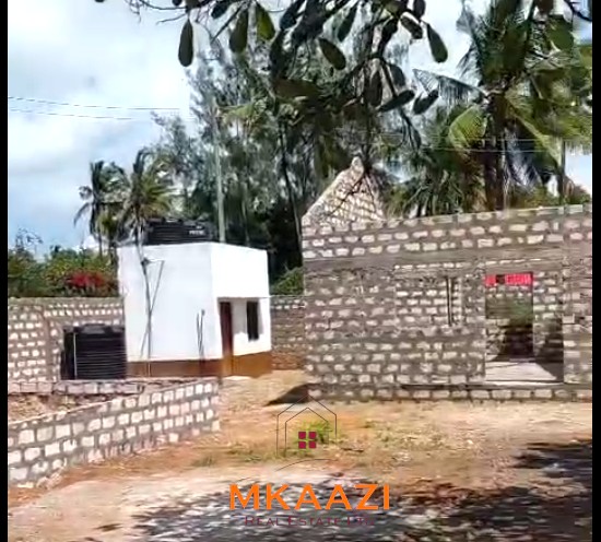 Half Acre Property for Sale Near Watamu Mall Half-acre property for sale off Kanani Road in Watamu with a 2-bedroom house, 1-bedroom SQ and three unfinished rental units near Watamu Mall.