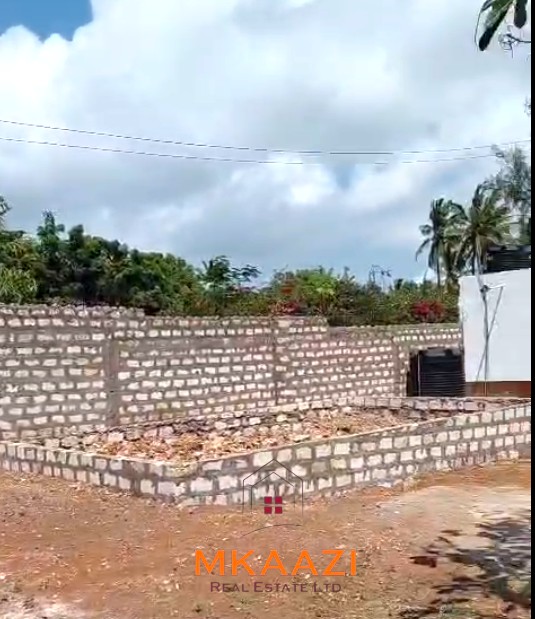 Half Acre Property for Sale Near Watamu Mall Half-acre property for sale off Kanani Road in Watamu with a 2-bedroom house, 1-bedroom SQ and three unfinished rental units near Watamu Mall.