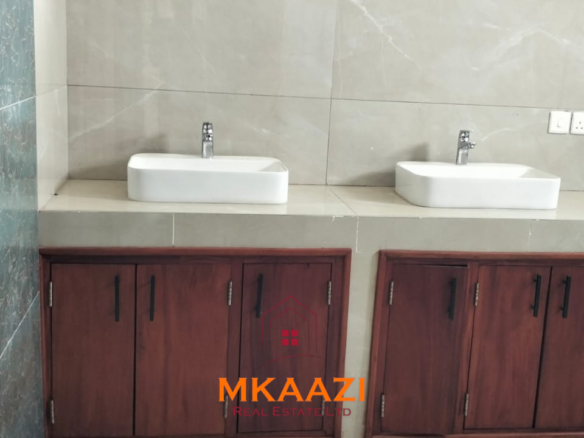 Luxury 4-bedroom villa for sale in Carolina Residence on Casuarina Road, Malindi with solar backup, swimming pool, gazebo, and ready for immediate occupancy.