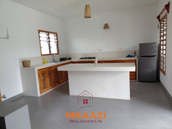 Fully furnished 3-bedroom all-ensuite villa with swimming pool, staff house, borehole, and landscaped garden for sale in Fragola, Watamu.