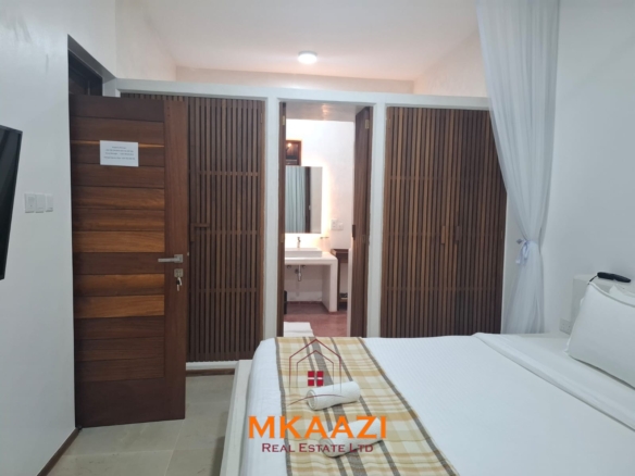 Luxury 3-bedroom beachfront villa for short-term rental in Kuruwitu, Vipingo with ocean views, private beach access, shared swimming pool, and modern interiors.