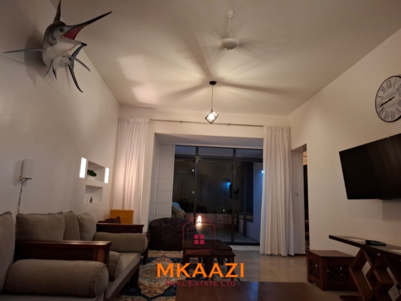 Luxury 3-bedroom beachfront villa for short-term rental in Kuruwitu, Vipingo with ocean views, private beach access, shared swimming pool, and modern interiors.